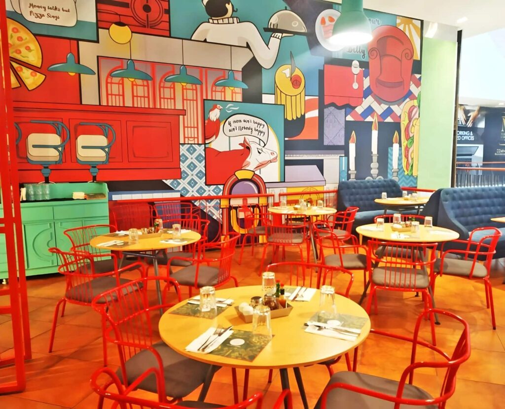 Colourful dining area at Toscano, VR Chennai, Anna Nagar