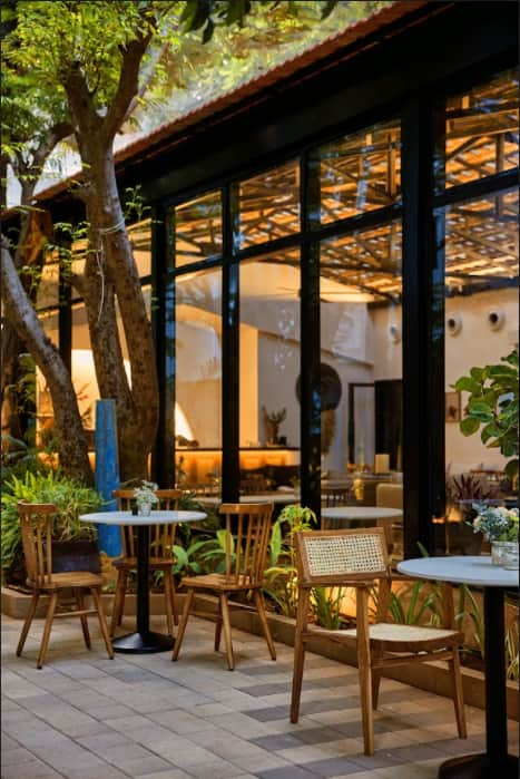Sage and Lavender Bistro glass frontage and garden patio in Alwarpet, Chennai